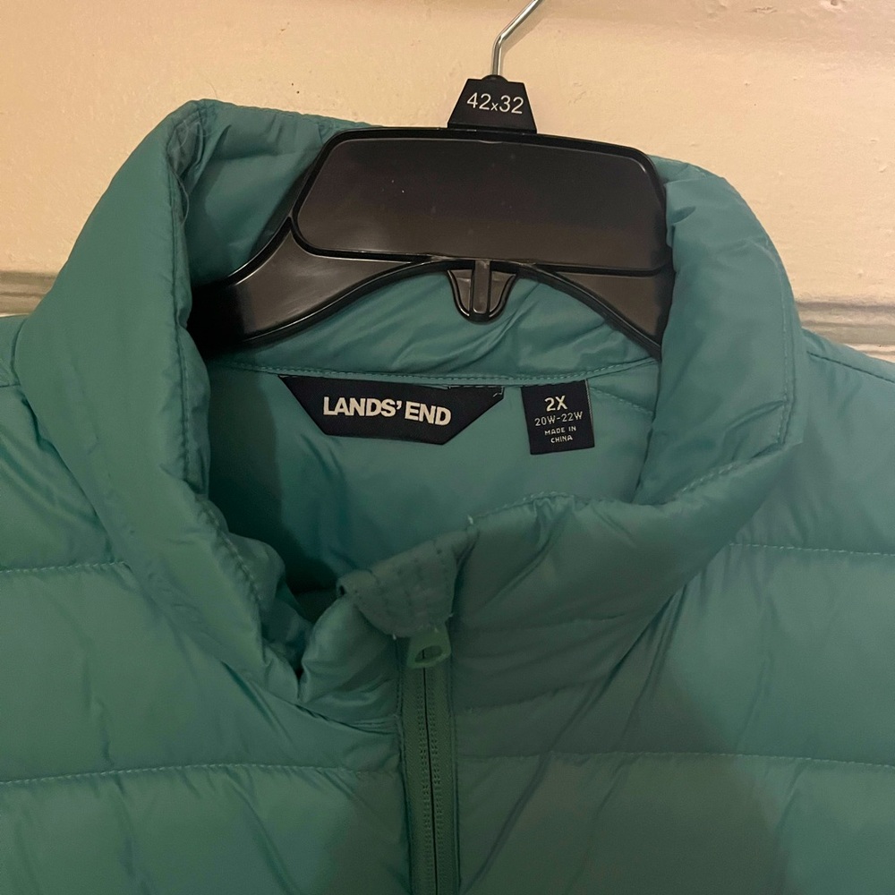 This a light down goose 3 quarter sleeveless vest and it can be folded up